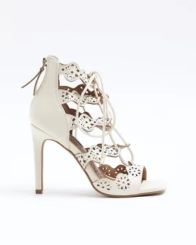 Cream cut out tie up heeled sandals