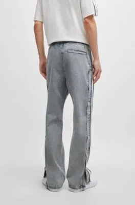 Grey relaxed-fit jeans with side poppers and contrasting tape