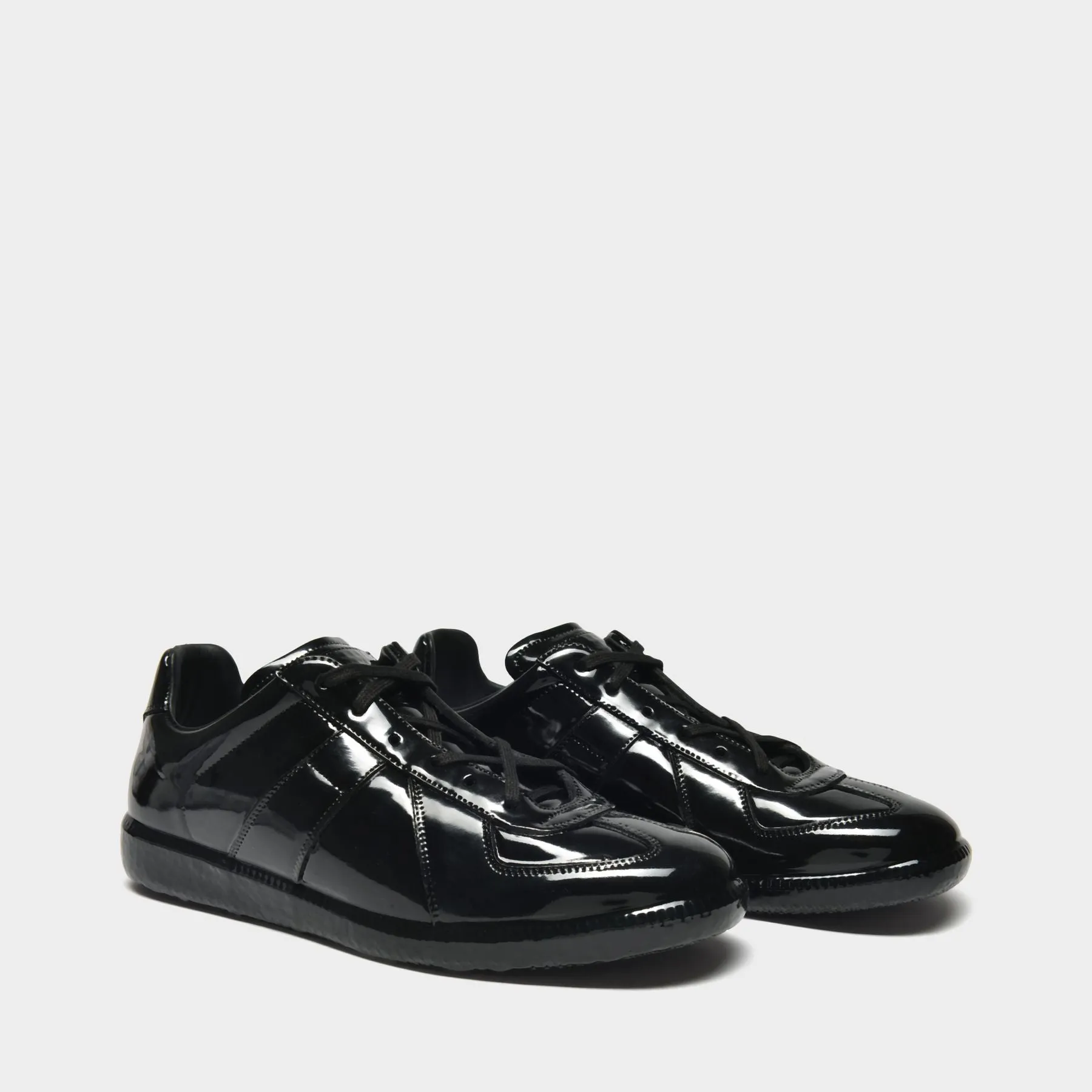 Maison Margiela  Replica Low Top Sneakers in Black Leather