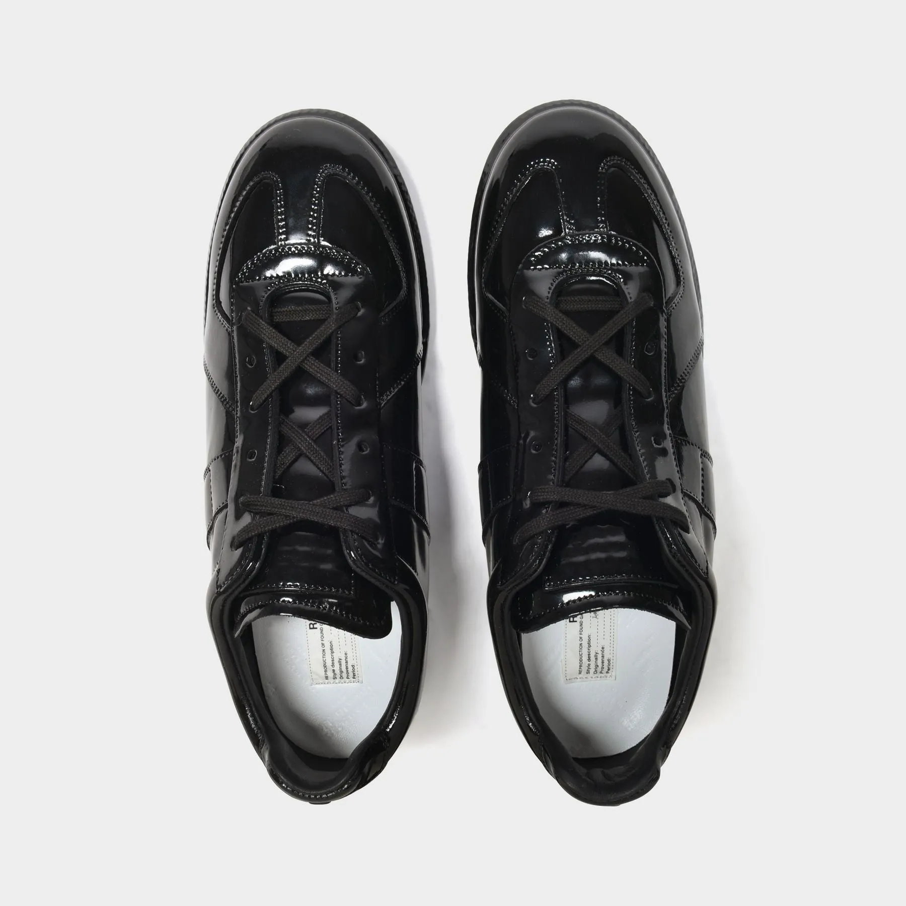 Maison Margiela  Replica Low Top Sneakers in Black Leather