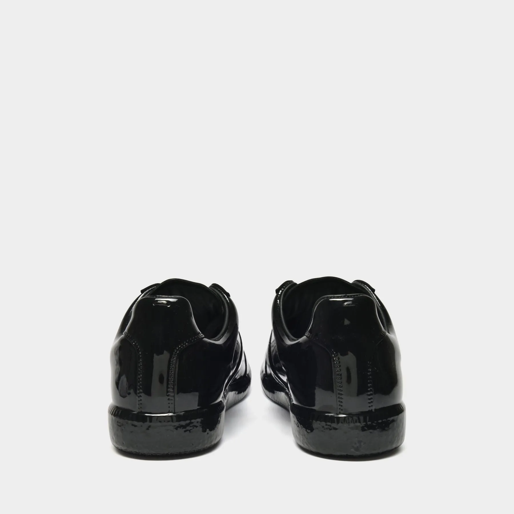 Maison Margiela  Replica Low Top Sneakers in Black Leather