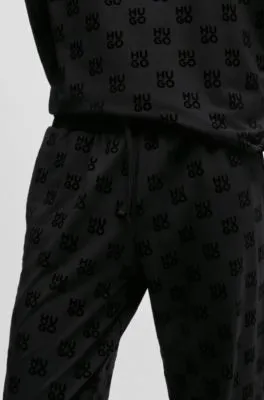 Straight-leg tracksuit bottoms with flock-print stacked logos